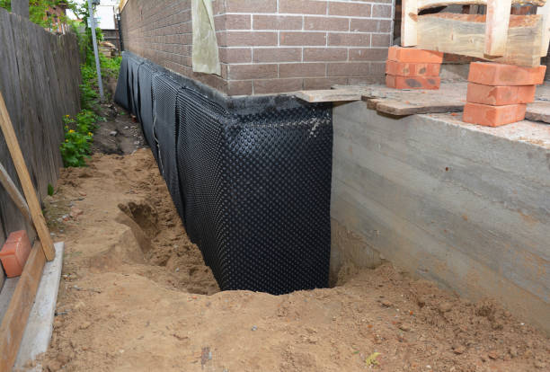 Happy homeowners after waterproofing job in Gadsden